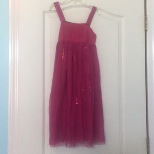 A special occasion/causal pink dress with ribbon.